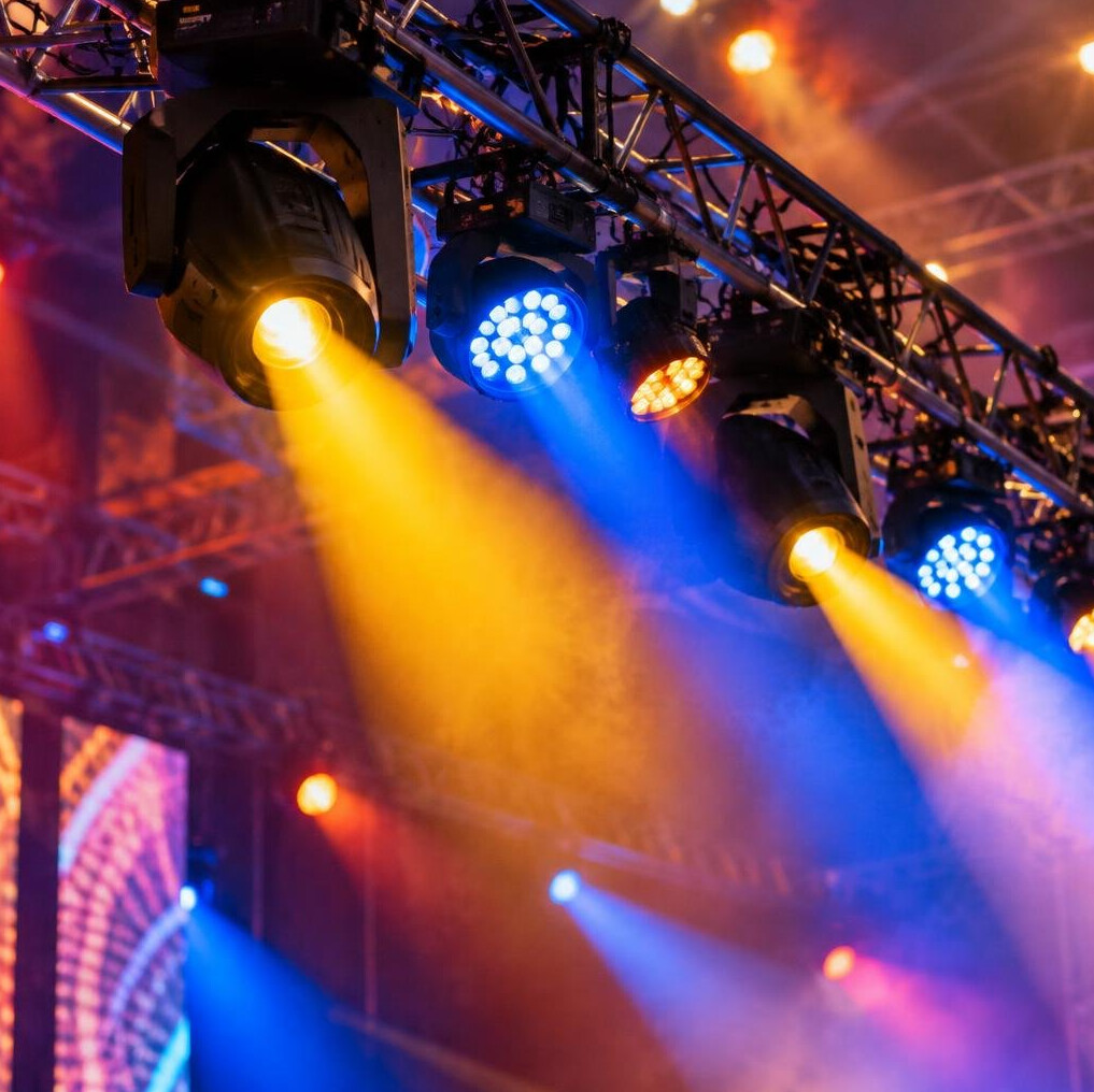 Colorful stage lighting rig close-up
